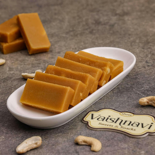 Horlicks Burfi on a plate: "Deliciously crafted Horlicks Burfi displayed on a decorative plate, showcasing its rich, golden-brown color and enticing texture."