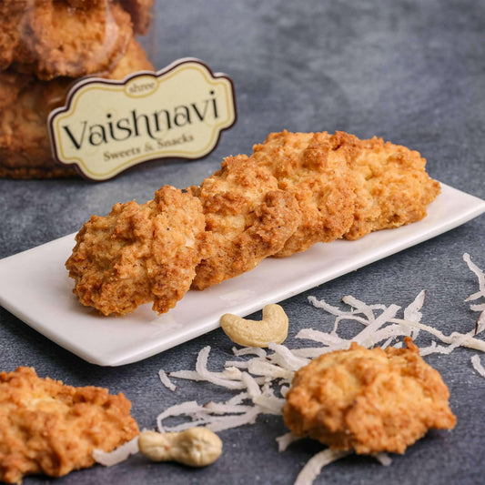 Close-up of Coconut Biscuits: "Delicious coconut biscuits with a golden-brown crust and shredded coconut topping on a rustic wooden background.