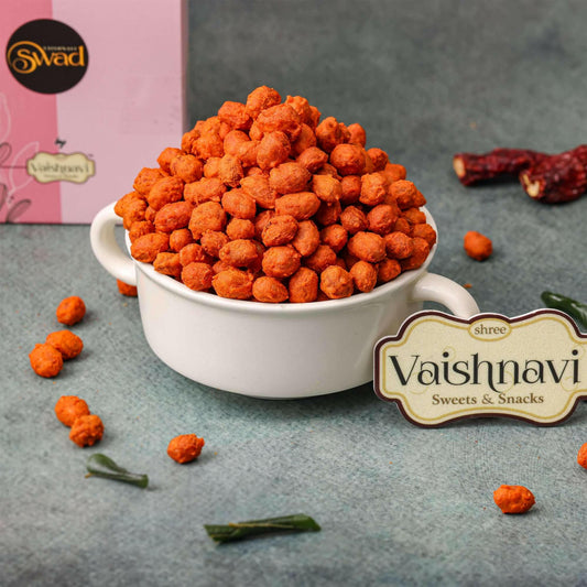 "Spiced roasted peanuts with a crispy texture, garnished with Indian spices, served in a bowl."